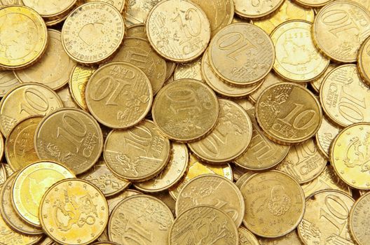 Pile of 10 cents euro euro coins for background