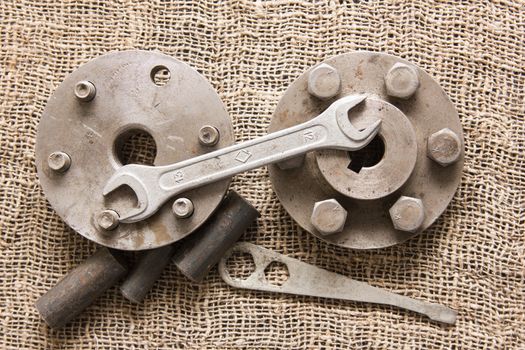 old rusty tools and details on the rough fabric. Instruments on sacking