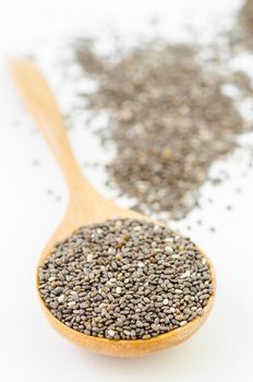 Nutritious chia seeds on a wooden spoon.