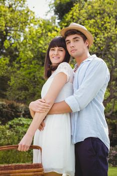 Portrait of young couple embracing each other in garden