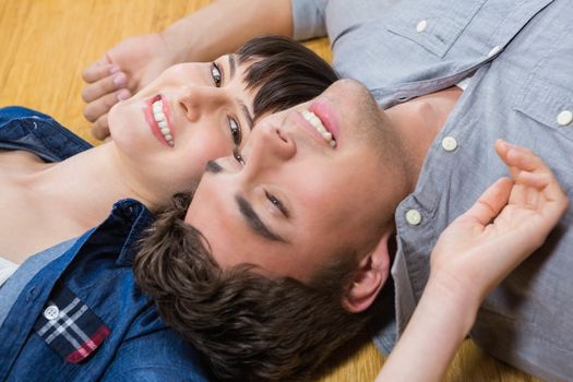 Romantic couple at home relaxing on the floor