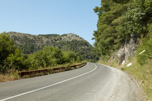 panoramic  view of nice summer empty road  through the mountain
