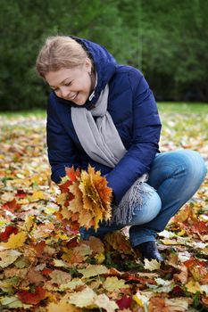 Portrait of young nice woman in fall season environment