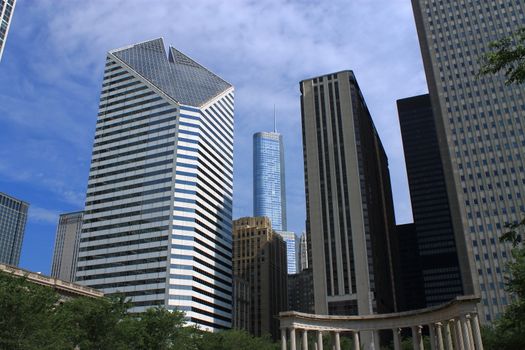 Chicago buildings and the Millenium Monument, as seen from Wrigley Square in Millennium Park