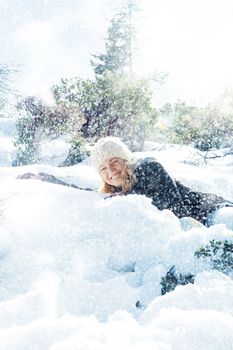 Portrait of young beautiful woman on winter outdoor background