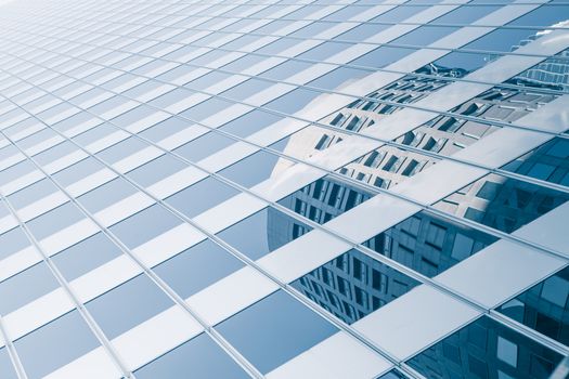 View of modern blue colored building made of glass