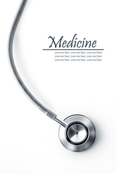 Close up view of grey stethoscope on white back