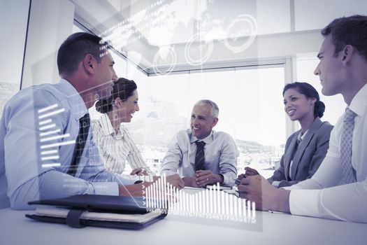 Abstract technology interface against business team sitting together around the table 