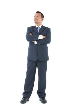 Asian business man with business suit looking up, isolated on white background