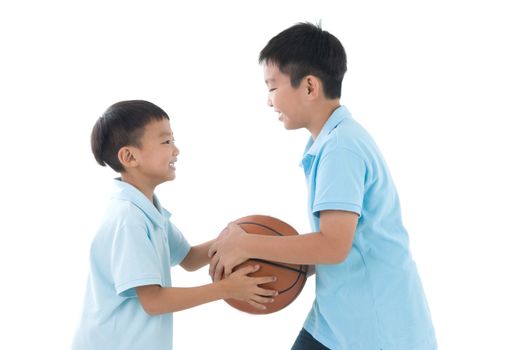 Asian kids playing basketball