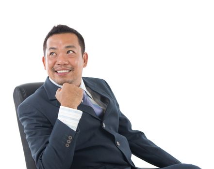 Good looking mature Asian Indonesian business man with business suit looking at side, isolated on white background. 