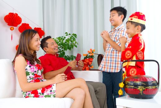 Chinese boys wishing their parent a happy chinese new year