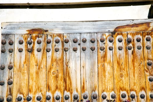 brown  morocco in africa the old wood  facade home and rusty safe padlock 