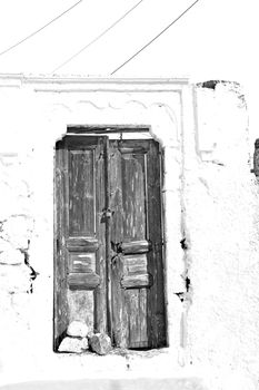 blue door      in antique village santorini greece europe   and white wall