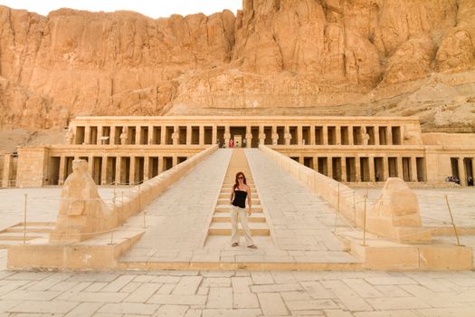 Female tourist in Ancient Egyptian Temple of Hatshepsut. Luxor, Egypt.