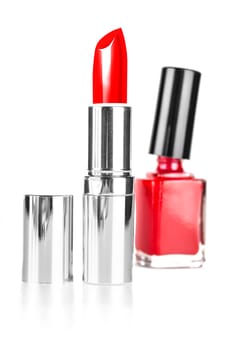 red lipstick and nail polish on a white background