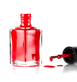 red nail polish closeup on white background