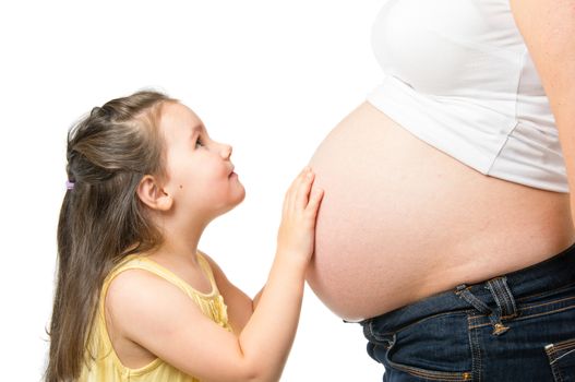 Little girl and pregnant mother isolated on white