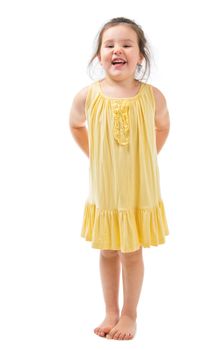 Happy little girl in yellow dress isolated on white