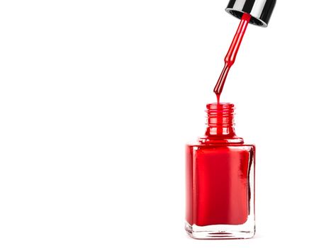 red nail polish closeup on white background
