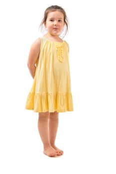 Little girl in yellow dress isolated on white