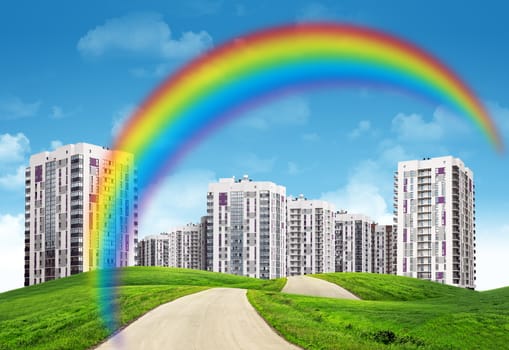 City on field with road and rainbow, nature concept