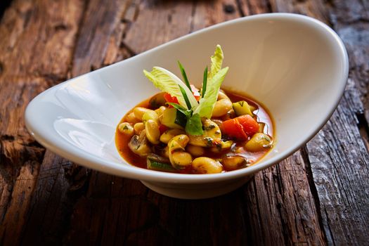 Baked beans in tomato sauce on plate.  Healthy  food, vegan or diet nutrition concept.