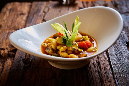 Baked beans in tomato sauce on plate.  Healthy  food, vegan or diet nutrition concept.