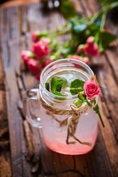 fresh mojito on a rustic table. Shallow dof