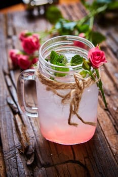 fresh mojito on a rustic table. Shallow dof