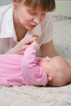 picture of happy mother with adorable baby (focus on woman)