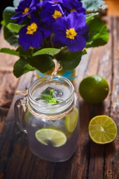 fresh mojito on a rustic table. Shallow dof