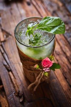 fresh mojito on a rustic table. Shallow dof