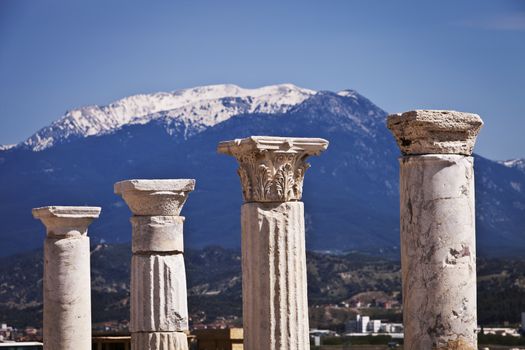 Corinthian and Doric columns in front of snow capped mountains at Laodicea