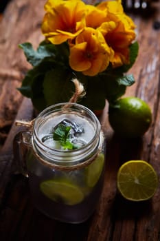 fresh mojito on a rustic table. Shallow dof