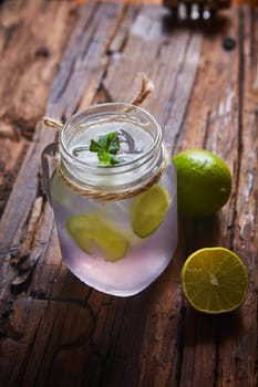 fresh mojito on a rustic table. Shallow dof