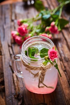 fresh mojito on a rustic table. Shallow dof