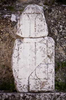Cross carved in stone at the ruins of Laodicea