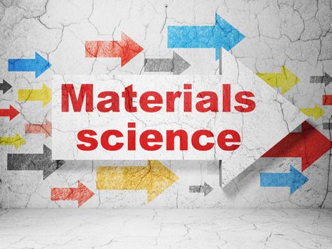 Science concept:  arrow with Materials Science on grunge textured concrete wall background