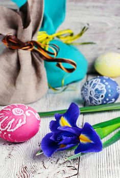 Painted Easter eggs,a iris flower and pouches with ears