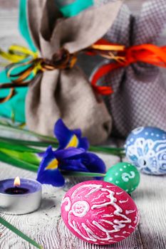 Painted Easter eggs,a iris flower and pouches with ears