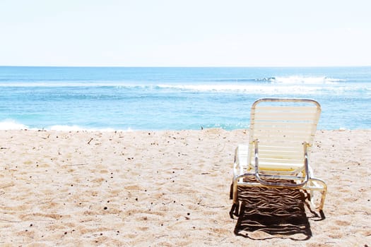 chair on the beach with summer sunlight at Kauai, Hawaii