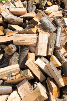 Chopped firewood on a stack. Firewood background