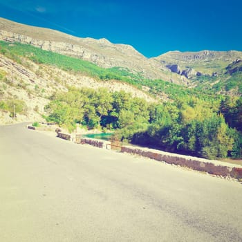 Asphalt Road along the River Bank in French Alps, Instagram Effect