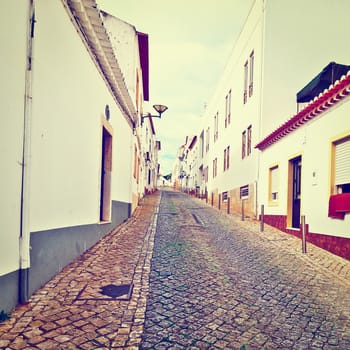 Narrow Street in the Medieval Portuguese City of Logos, Vintage Style Toned Picture 