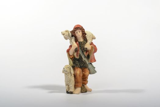 Shepherd with his sheep, element of the Christmas nativity. White background.