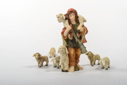 Shepherd with his sheep, element of the Christmas nativity. White background.