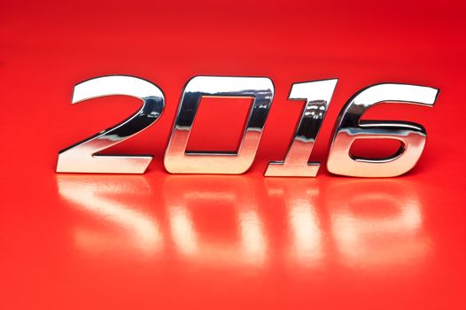 Metallic number 2016 over red background
