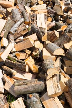 Chopped firewood on a stack. Firewood background