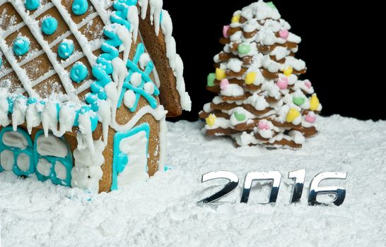 Gingerbread house and christmas tree with digits 2016